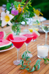 Wall Mural - Family outdoor dinner in the garden in summer at sunset. Picnic food and drink concept