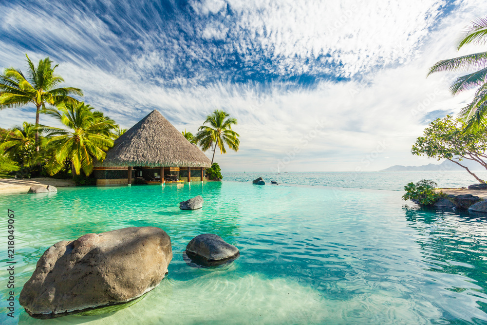 Infinity pool with palm tree rocks, Tahiti, French Polynesia - obrazy, fototapety, plakaty 