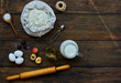 © eskstock - Baking background with copy space. Cooking ingredients for dough and pastry, eggs, flour and butter on dark rustic wood. Homemade baking theme. Top view, mockup for menu, recipe for culinary classes.