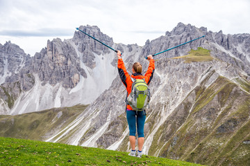 Wall Mural - young woman hiking in the mountains