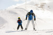 © Tomsickova - Father and son, preschool child, skiing in austrian ski resort in the mountains