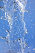© schankz - Splashing water with drops on the sky background