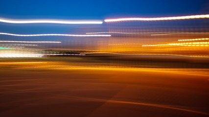 Photo in motion at night as an abstract background