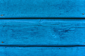 Wall Mural - Freshly painted simple wooden table, deep blue vibrant color.