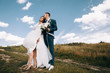 © pha88 - Newlyweds on the background of blue sky.Wedding photo