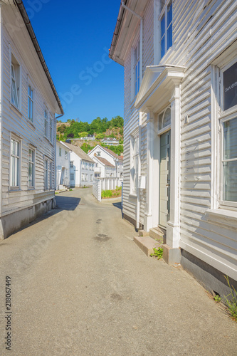 white-wooden-houses-in-a-little-alley-in-flekkefjord