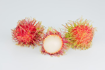 peel rambutan , red hairy skin fruit sweet and delicious thai famous tropical fruit on white background