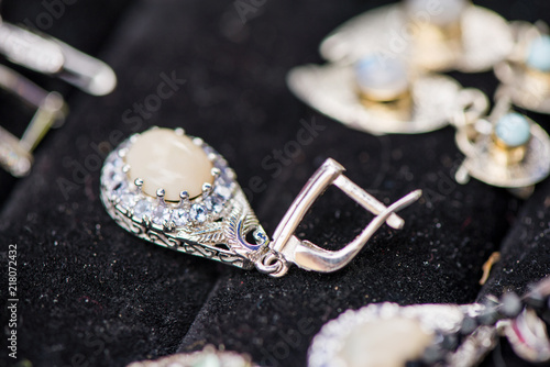 Fotografia, Obraz Silver earrings made of tanzanite stone and fire opal
