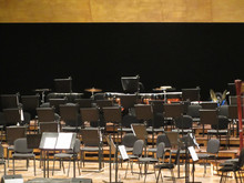 Empty Chairs Stand On Stage In Concert Hall
