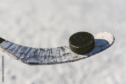 Fototapeta na szkło close-up of sticks and pucks in the stadium