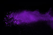 Abstract purple powder explosion on black background. abstract colored powder splatted, Freeze motion of colorful powder exploding.