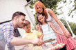 © ivanko80 - Father teaching children how to cooking meat on barbecue grill