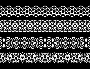 Set of Celtic designs in white on a black background. Vectors are isolated.