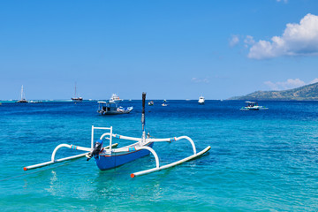 Vacation holidays concept background. Beautiful bay tropical island. Amazing marine view with boats, bright blue sky with clouds,clear colorful water in turquoise and azure tones. Nature landscape.