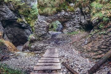 Wall Mural - Rock window on the Sucha Bela famous hiking trail in park called Slovak Paradise, Slovakia