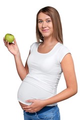 Canvas Print - Young pregnant woman holding green apple isolated on white