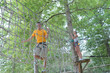 © auremar - man in gear climbs in the park adventure