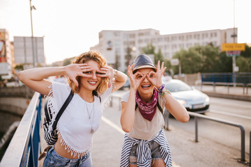 Wall Mural - Summertime fun. Two girls having fun in the city.