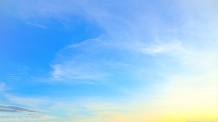 Fluffy white cloud on blue sky before sunset in the evening.