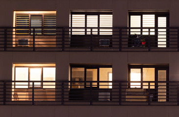 Wall Mural - Apartment windows at night in the city.