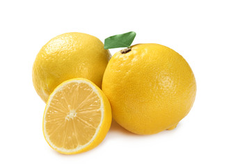 Ripe whole and sliced lemons on white background