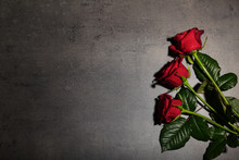 Beautiful Red Roses On Grey Background, Top View. Funeral Symbol