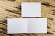 Mockup of white booklet on bamboo background.