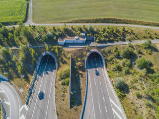 Canvas Print - Aerial view of tunnel entrance of highway in Switzerland