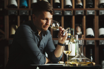 Wall Mural - Degustation process of sommelier in wine cellar