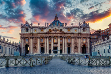 St. Peter's Basilica in Rome, Italy, at sunset. Colourful travel background with dramatic sky.