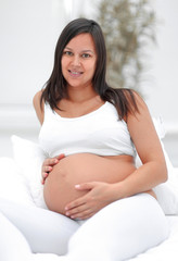 Wall Mural - portrait of a happy pregnant woman.