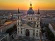 Budapest, Hungary - The rising sun shining through the tower of the beautiful St.Stephen's Basilica (Szent Istvan Bazilika) at sunrise on an aerial shot