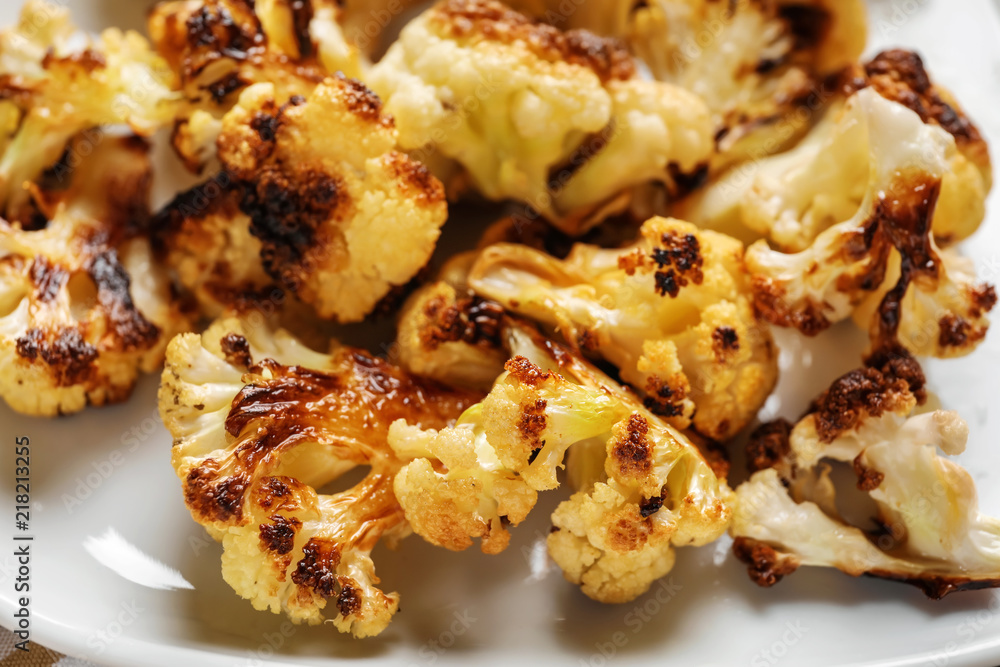 Tasty grilled cauliflower on plate, closeup