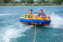 Young Couiple On Water Attractions During Summer Vacations