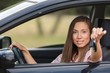 © BillionPhotos.com - Portrait of a Smiling Woman Looking out of the Window of her Car