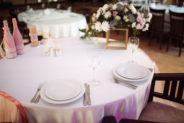 Wall Mural - Sparkling glassware stands on long table prepared for wedding dinner.