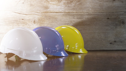 Engineer, electrician and worker 's helmet color as White, Blue and Yellow , PPE  (Personal Protective Equipment) very importance for health protection. Safety at work concept