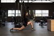 © Wavebreak Media - Young woman exercising in gym