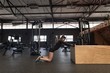 © Wavebreak Media - Woman doing stretching exercise in fitness studio