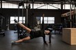 © Wavebreak Media - Young woman exercising in gym