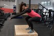 © Wavebreak Media - Woman doing squat exercise in fitness studio