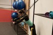 © Wavebreak Media - Woman doing exercise with suspension cable in fitness studio
