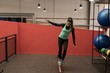 © Wavebreak Media - Woman doing exercise with rubber band in fitness gym