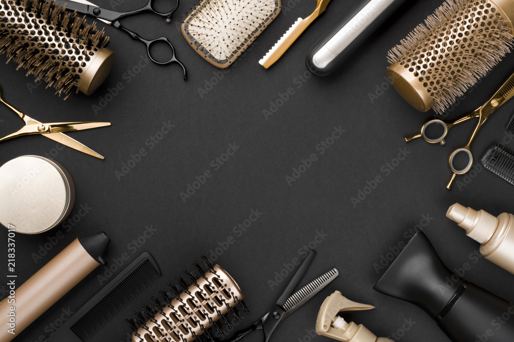 Hairdresser tools on black background with copy space in center - obrazy, fototapety, plakaty 
