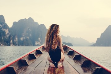 Beautiful woman posing on a boat