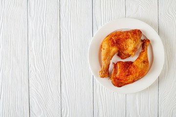 Sticker - fried chicken legs on a white plate