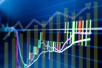 Stock market graph and candlestick chart for financial investment concept.