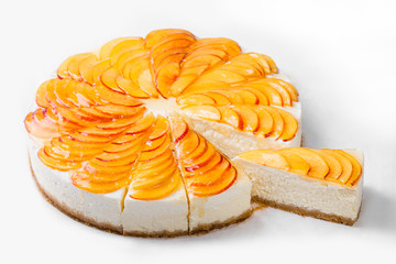 Wall Mural - Cheese cake with peach slices isolated on white background