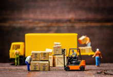 Miniature Warehouse Workers Forklift Carrying Goods Box To Semi Truck With Trailer .logistics Warehouse Freight Transportation Concept