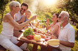 © ivanko80 - Family on vacation eating outdoors